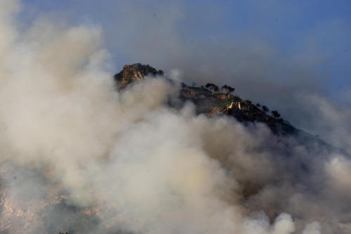 Djamila Grossman  |  The Salt Lake Tribune

A wildfire burns in the hills above the University of Utah Research Park in Salt Lake City, Utah, on Sunday, July 3, 2011.