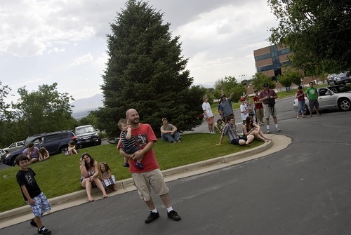 Djamila Grossman  |  The Salt Lake Tribune

People watch from a parking lot as a wildfire burns in the hills above Red Butte Garden and the new Utah Museum of Natural History in Salt Lake City, Utah, on Sunday, July 3, 2011.