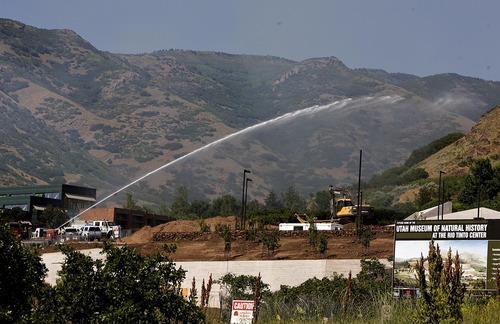 Djamila Grossman  |  The Salt Lake Tribune

Fire crews spray water on flames of a wildfire that burns in the hills above Red Butte Garden and the new Utah Museum of Natural History in Salt Lake City, Utah, on Sunday, July 3, 2011.