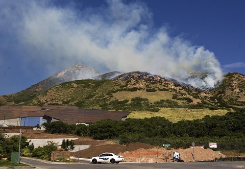 Djamila Grossman  |  The Salt Lake Tribune

A wildfire burns in the hills above Red Butte Garden and the new Utah Museum of Natural History in Salt Lake City, Utah, on Sunday, July 3, 2011.