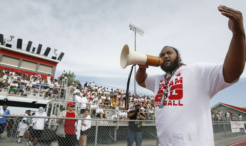 Francisco Kjolseth  |  The Salt Lake Tribune
Former Ute and current member of NY Jets Sione Po'uha welcomes the hundreds of youth gathered for his football camp at East High on Thursday, June 30, 2011.