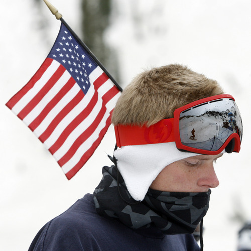Rick Egan   |  The Salt Lake Tribune

 D.J. Koppenall, Bountiful, wears the flag as he skis at Snowbird, Monday, July, 4, 2011