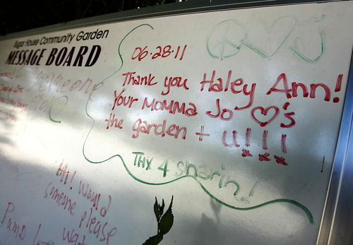 Scott Sommerdorf  |  The Salt Lake Tribune
A message appreciating the garden is posted on the garden's messgae board, Saturday, July 2, 2011. Volunteers created the Sugar House Community Garden on top of the temporarily disused Fairmont Park Tennis Courts. , Saturday, July 2, 2011