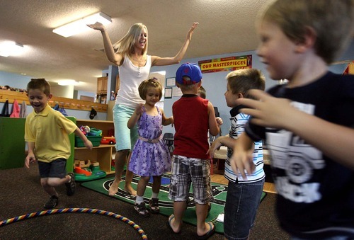 Leah Hogsten  |  The Salt Lake Tribune
Music instructor Kim Clark of Progressive Preschool and Child Care Center in Ogden keeps children singing and moving for 25 minutes on Thursday. Utah is the sixth least obese state in the United States in the rankings of child obesity. At Progressive, students now incorporate movement in their music class as the staff works to help the kids be more active and healthier.