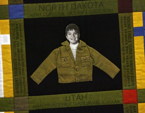 Steve Griffin  |  The Salt Lake Tribune

 The Lost Heroes Art Quilt consists of childhood photos of 50 servicemen and women, one from each state, who were killed in Iraq and Afghanistan. Utah's representative is Army private first class Daniel G. Dolan. Thursday, July 7, 2011