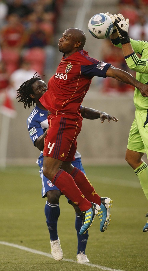 Trent Nelson  |  The Salt Lake Tribune
RSL's Jamison Olave leaps up to head the ball, but FC Dallas goalkeeper Kevin Hartman is there to block it. Real Salt Lake vs. FC Dallas at Rio Tinto Stadium in Sandy, Utah, Saturday, July 9, 2011. FC Dallas's Ugo Ihemelu at rear.
