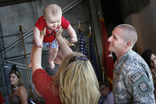 Scott Sommerdorf  |  The Salt Lake Tribune
Sgt Kevin Dimond watches as his mother Shelley Dimond hoists his son Wyatt, 6 months old, over her head as the Utah National Guard's 118th Engineer (Sapper) Company returned Sunday, July 10, 2011, from its 12-month deployment to Afghanistan. Sgt. Dimond had earlier seen Wyatt's birth on a leave during his deployment.