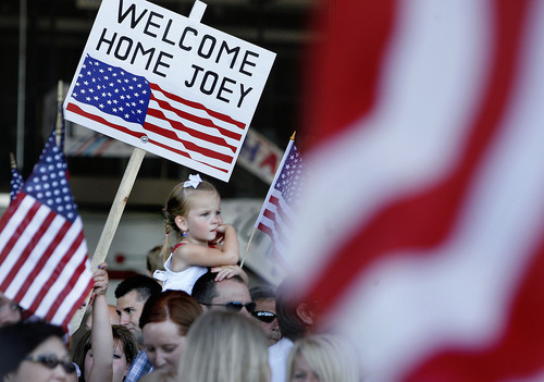 Scott Sommerdorf  |  The Salt Lake Tribune
Families waited for the return of the Utah National Guard's 118th Engineer (Sapper) Company Sunday, July 10, 2011. The unit completed its 12-month deployment to Afghanistan providing route-clearance support to Coalition forces.