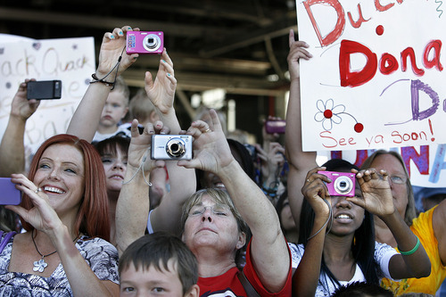 Scott Sommerdorf  |  The Salt Lake Tribune
Friends and family clamber to record the moment as their loved ones in the Utah National Guard's 118th Engineer (Sapper) Company return Sunday, July 10, 2011, from their 12-month deployment to Afghanistan.