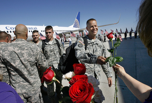 Scott Sommerdorf  |  The Salt Lake Tribune
Soldiers of the Utah National Guard's 118th Engineer (Sapper) Company were given roses to give to their sweethearts as they returned Sunday, July 10, 2011, from their 12-month deployment to Afghanistan.