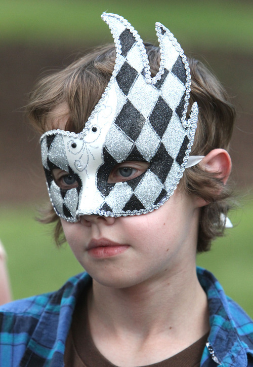 Rick Egan   |  The Salt Lake Tribune

Simon Thomas, 13, Austin, Texas, wears a mask be bought in the Utah Shakespeare Festival's gift shop, Thursday, July 7, 2011.