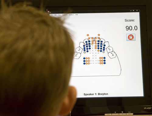 Al Hartmann  |  The Salt Lake Tribune
Five-year-old Breyton Banks uses a device called a palatometer in a speech therapy session  at the Comprehensive Clinic on BYU campus.   The custom-fit retainer allows therapists to use computers to watch precisely how kids pronounce words and help them correct their speech in real time on a computer screen.