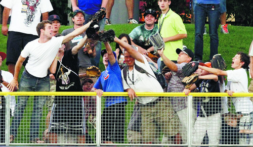 Rick Egan   |  The Salt Lake Tribune

Fans fight for a home run ball in the 2011 Triple-A All-Star Home Run Derby, Monday, July 11, 2011.