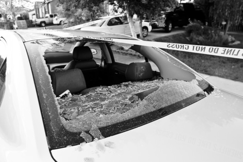 Chris Detrick  |  The Salt Lake Tribune 
The back windshield of a car was hit by a bullet near the scene of a shooting Tuesday at Mountain Man Park in Kearns. One victim was shot in his leg near 4900 South Heath Avenue (5150 West).