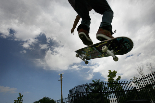 Scott Sommerdorf  |  The Salt Lake Tribune
Alex Izarraraz jumps and does a trick at the Taylorsville Skatepark at 4800 S., Redwood Road under the watchful eye of the camera on top of the pole in the background, Friday, July 8, 2011. Taylorsville has had cameras in its parks since late 2008.