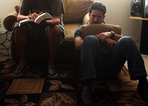 Leah Hogsten  |  The Salt Lake Tribune
Norberto Mendez, right, listens as interpreter and close friend Carlos Rosales read one of his son's favorite biblical passages.