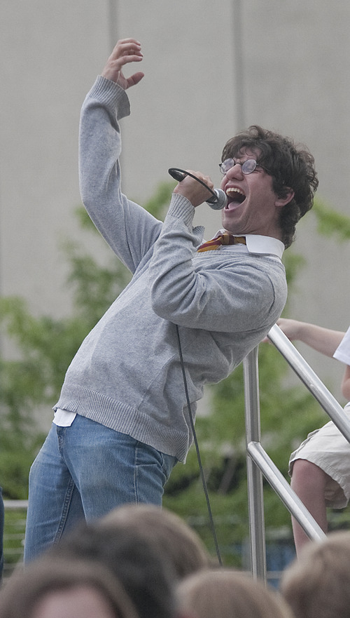 Margaret Distler  |  The Salt Lake Tribune

Singer Joe DeGeorge yells in the microphone during the Harry and the Potters concert in Library Square on Wednesday, June 29, 2011. DeGeorge and his older brother, Paul, created the rock band based on the popular Harry Potter book series in 2002.