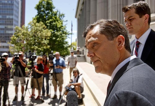 Trent Nelson  |  The Salt Lake Tribune
Attorney Jonathan Turley answers questions on the steps of the U.S. District Court in Salt Lake City on Wednesday, July 13, 2011, about his legal challenge to Utah's law against polygamy on behalf of the Kody Brown family. At right rear is attorney Adam Alba.