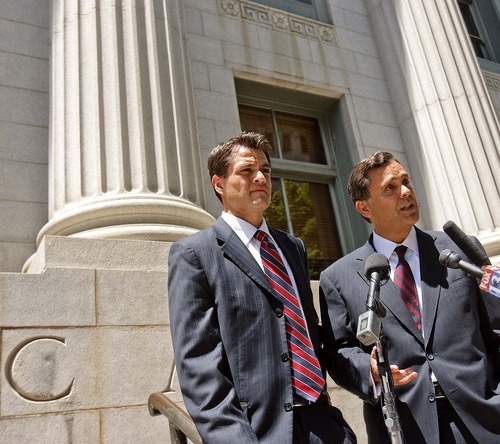 Trent Nelson  |  The Salt Lake Tribune
Attorney Jonathan Turley, right, answers questions on the steps of the U.S. District Court in Salt Lake City on July 13 about his filing challenging Utah's law against polygamy on behalf of the Kody Brown family. At left is attorney Adam Alba