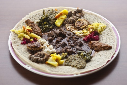 Chris Detrick  |  The Salt Lake Tribune 
The Wal-Maka plate for two ($18.25) at African Restaurant includes kochee foanii, waaddii, ashaakiltii, alichaa misira, kochee misira, kochee shiro, raafuu, dimaa and dabaqula served on budenaa.