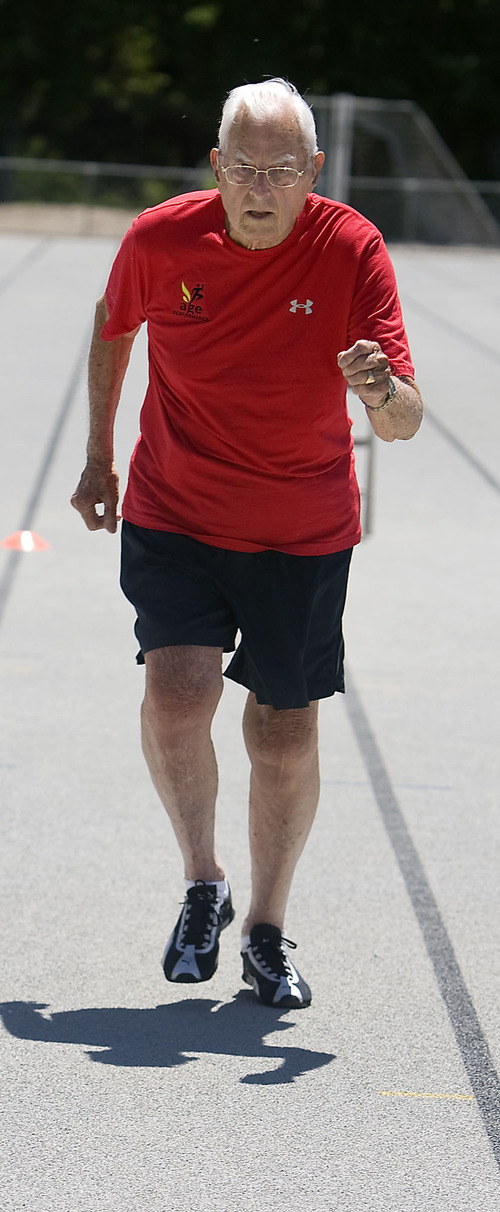 Al Hartmann  |  The Salt Lake Tribune
Ted Belknap, 90, is training to run the 50-meter-dash at the Huntsman Games this summer.   He takes off in 95-degree heat on the Highland High School track for his one-time practice sprint.  He ran it in 22 seconds.