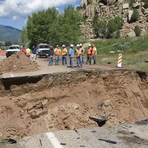 Al Hartmann  |  The Salt Lake Tribune
Road contractors check out a 25-foot-deep 40-foot-wide hole on Highway 35 about 3 miles south of Tabiona on Thursday morning. A Tabiona girl was killed and two people injured when their vehicles encountered the washed-out road Wednesday night.