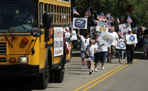 Francisco Kjolseth  |  The Salt Lake Tribune
Davis School District, which is celebrated its 100th birthday on July 17, joined the Farmington Festival Days Parade as district teachers and leaders follow behind a yellow school bus.