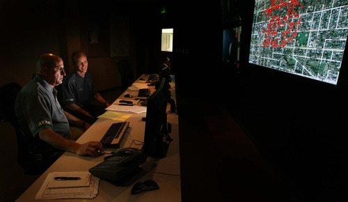 Leah Hogsten  |  The Salt Lake Tribune
Ogden Crime Center police officers Nick Poorte  (right) and Bob Evans are among four employees who staff the 