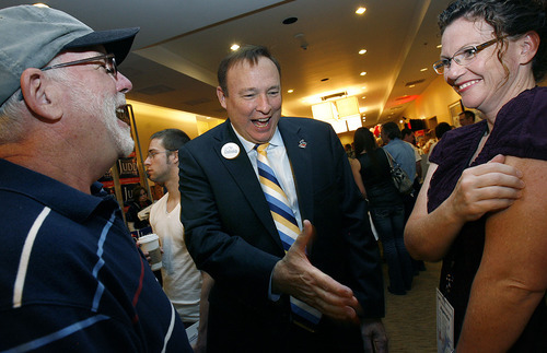 Scott Sommerdorf  |  The Salt Lake Tribune
Jim Dabakis, candidate for Utah Democratic party chairman, center, speaks with the Syracuse Mayor Jamie Nagle, right, and Bing Kerwood at the Democratic convention at the Hilton Hotel in downtown Salt Lake City on Saturday.