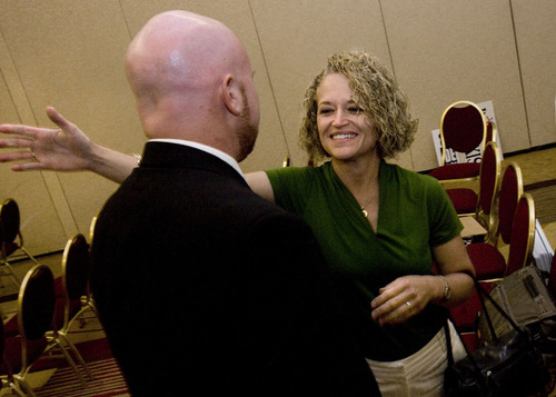 Scott Sommerdorf  |  The Salt Lake Tribune
Retiring representative for District 30 Jackie Biskupski reaches to congratulate her replacement, Brian Doughty.