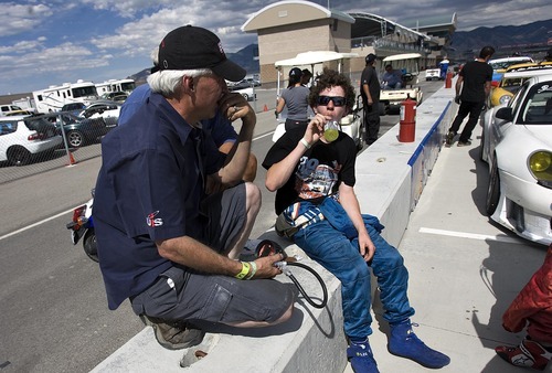 Djamila Grossman  |  The Salt Lake Tribune

Madison Snow, 15,  talks to his dad, Martin Snow, after winning a race at the Miller Motorsports Park in Tooele on Sunday, July 17, 2011. Madison grew up in a successful racing family and has been winning a lot of races, including that one.