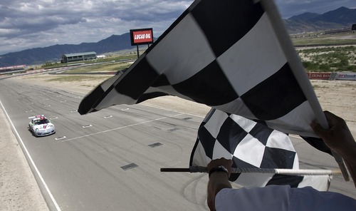 Djamila Grossman  |  The Salt Lake Tribune

Madison Snow, 15,  finishes first in a race at the Miller Motorsports Park in Tooele on Sunday, July 17, 2011. Madison grew up in a successful racing family and has been winning a lot of races.