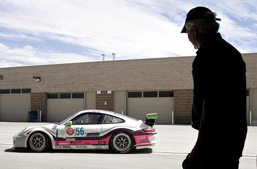 Djamila Grossman  |  The Salt Lake Tribune

Martin Snow watches his son, Madison Snow, 15, drive off in the family's Porsche for a race at the Miller Motorsports Park in Tooele on Sunday, July 17, 2011. Madison grew up in a successful racing family and has been winning a lot of races.