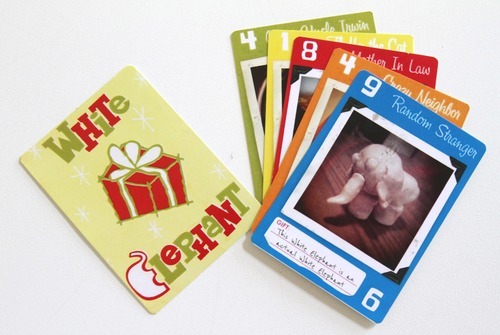 Rick Egan   |  The Salt Lake Tribune
Players try to make sure they get cards bearing the right gift for the right person in the White Elephant card game that Riverton resident Brian Kelley created. He is raising money to develop it through a website called Kickstarter.