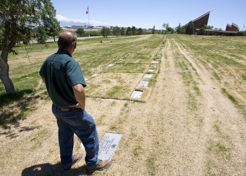 Al Hartmann  |  The Salt Lake Tribune
Arnold Warner, grounds supervisor for the Utah Veterans Cemetery, checks out a row of grave markers that have settled and shifted due to heavy machinery used to maintain the cemetery. The cemetery has received $4.45 million in federal money to renovate and expand the cemetery.