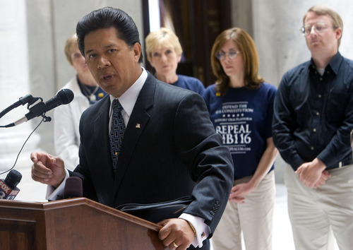 Al Hartmann  |  The Salt Lake Tribune
Arturo Morales speaks to proponents of repealing HB116  at a rally in the Capitol Rotunda on Wednesday.