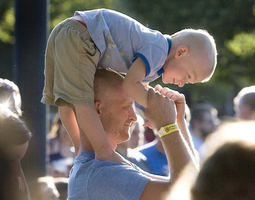 Paul Fraughton  |  The Salt Lake Tribune
While waiting for the concert to begin, Finn House, 2, has some fun with his dad, Dave House, at the Twilight Concert Series at Pioneer Park in Salt Lake City on  Thursday,  July 21, 2011.