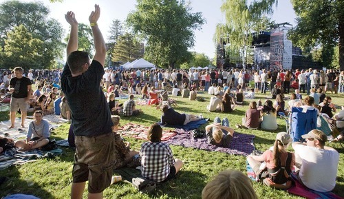 Paul Fraughton  |  The Salt Lake Tribune
A fan, some distance from the stage, gives some support to Typhoon, the opening act for The Decemberists at the Twilight Concert Series at Pioneer Park in Salt Lake City on Thursday,  July 21, 2011.