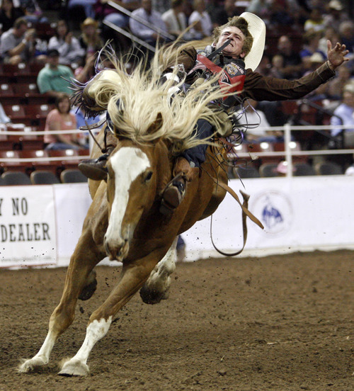 Rick Egan   |  The Salt Lake Tribune

Tom McFarland, Wickenburg, Arizona, competes in the bareback competition at The Days of 47' Rodeo, at the Maverick Center, Wednesday, July 20, 2011