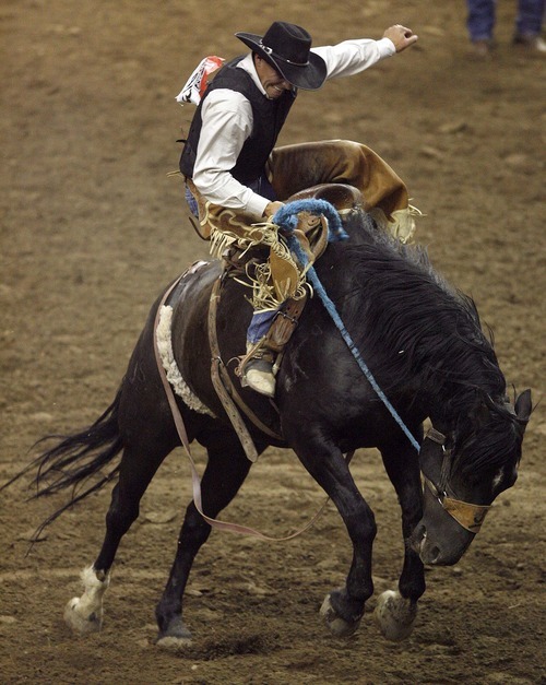 Trent Nelson  |  The Salt Lake Tribune
Shelby Terry of Bear River, Utah, in the Saddle Bronc Riding competition at the Days of 47 Rodeo, Maverik Center in West Valley City, Utah. Friday, July 22, 2011.