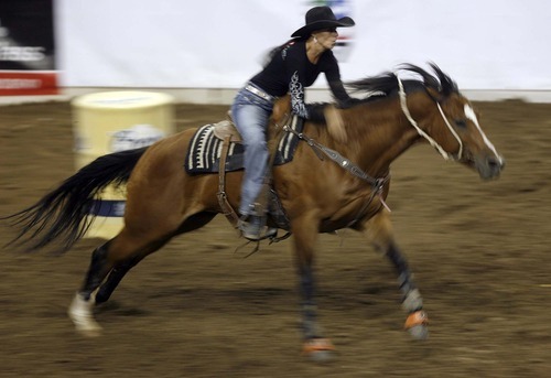 Trent Nelson  |  The Salt Lake Tribune
Jody Sheffield of Ogden, Utah, in the Barrel Racing competition at the Days of 47 Rodeo, Maverik Center in West Valley City, Utah. Friday, July 22, 2011.