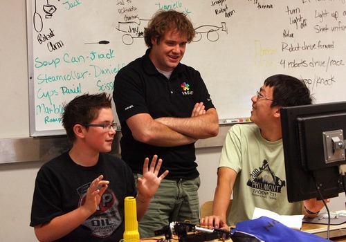 Leah Hogsten  |  The Salt Lake Tribune
Rube Goldberg contraption designers Elijah Grubb, 15, of South Weber, and Andrew Wong, 15 of Houston, share a laugh with graduate student Thomas Taylor during the University of Utah's high school advanced robotics summer camp on Friday at the Merrill Engineering Building.