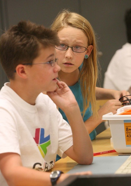 Leah Hogsten  |  The Salt Lake Tribune
Tony Sabia, 12, and Zoe Reid, 11,  work on creating robots during the University of Utah's GREAT summer camp on Friday at the Merrill Engineering Building.