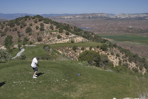 Margaret Distler  |  The Salt Lake Tribune

The Salt Lake Tribune sports writer Gordon Monson tees off on hole 4 at Palisade State Park golf course in Sterling, Utah on Monday, June 27, 2011. The hole overlooks the Palisade Reservoir and the surrounding Sanpete County.