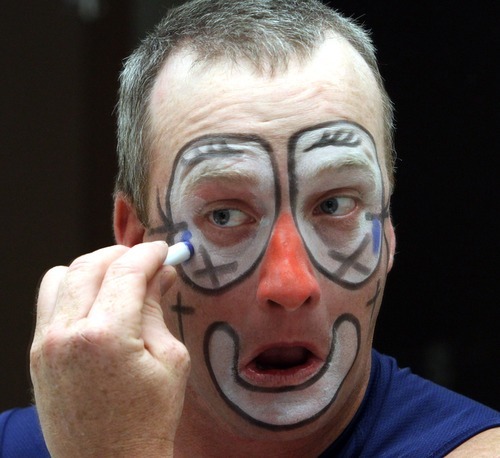 Rick Egan   |  The Salt Lake Tribune

Rodeo clown/bullfighter, Dustin Brewer puts on his make-up before The Days of 47' Rodeo, at the Maverick Center, Wednesday, July 20, 2011