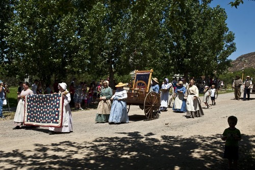 Chris Detrick | The Salt Lake Tribune 
Participants in the Village Parade walk along Main Street during Pioneer Days Festival at This Is the Place Heritage Park Saturday July 23, 2011.