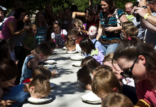 Chris Detrick | The Salt Lake Tribune 
Children participate in a pie eating contest during Pioneer Days Festival at This Is the Place Heritage Park Saturday July 23, 2011.