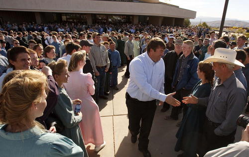 Trent Nelson  |  The Salt Lake Tribune
FLDS member Willie Jessop shakes hands and shares smiles with other FLDS followers in front of the 5th district courthouse Friday, November 14, 2008 after the Utah Attorney General's Office stepped in to seek a resolution to litigation involving the sect's UEP  land trust. The hearing, which sparked an unprecedented public showing of FLDS members, was continued in order to allow time for  both sides to discuss a 