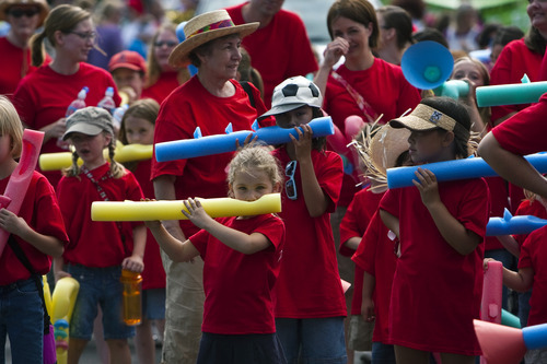 Chris Detrick  | The Salt Lake Tribune
Members of the Taylorsville North Stake play foam instruments along 500 South during the Days of '47 youth parade in 2010.