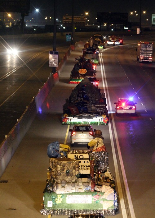 Rick Egan   |  The Salt Lake Tribune

Floats prepared for the Days of '47 Parade make their way along I-15 from Sandy to the staging area in downtown Salt Lake City in the early hours on Monday, July 25, 2011.